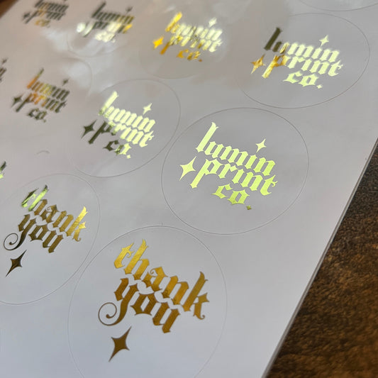 White Stickers with Foiled Text