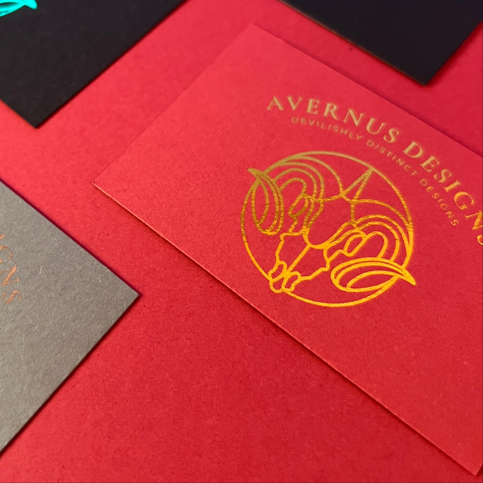 Gold Foiled Logo on Red Matte Cardstock Business Card