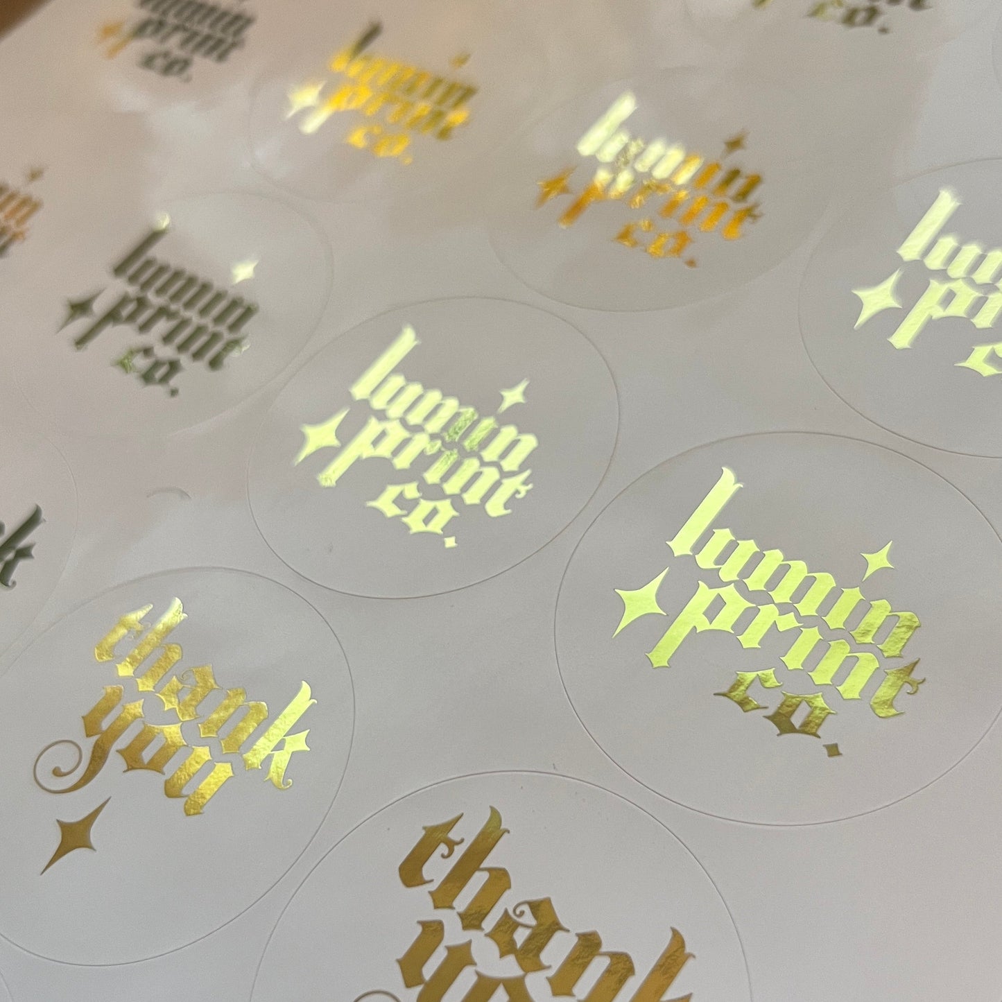White Stickers with Foiled Text