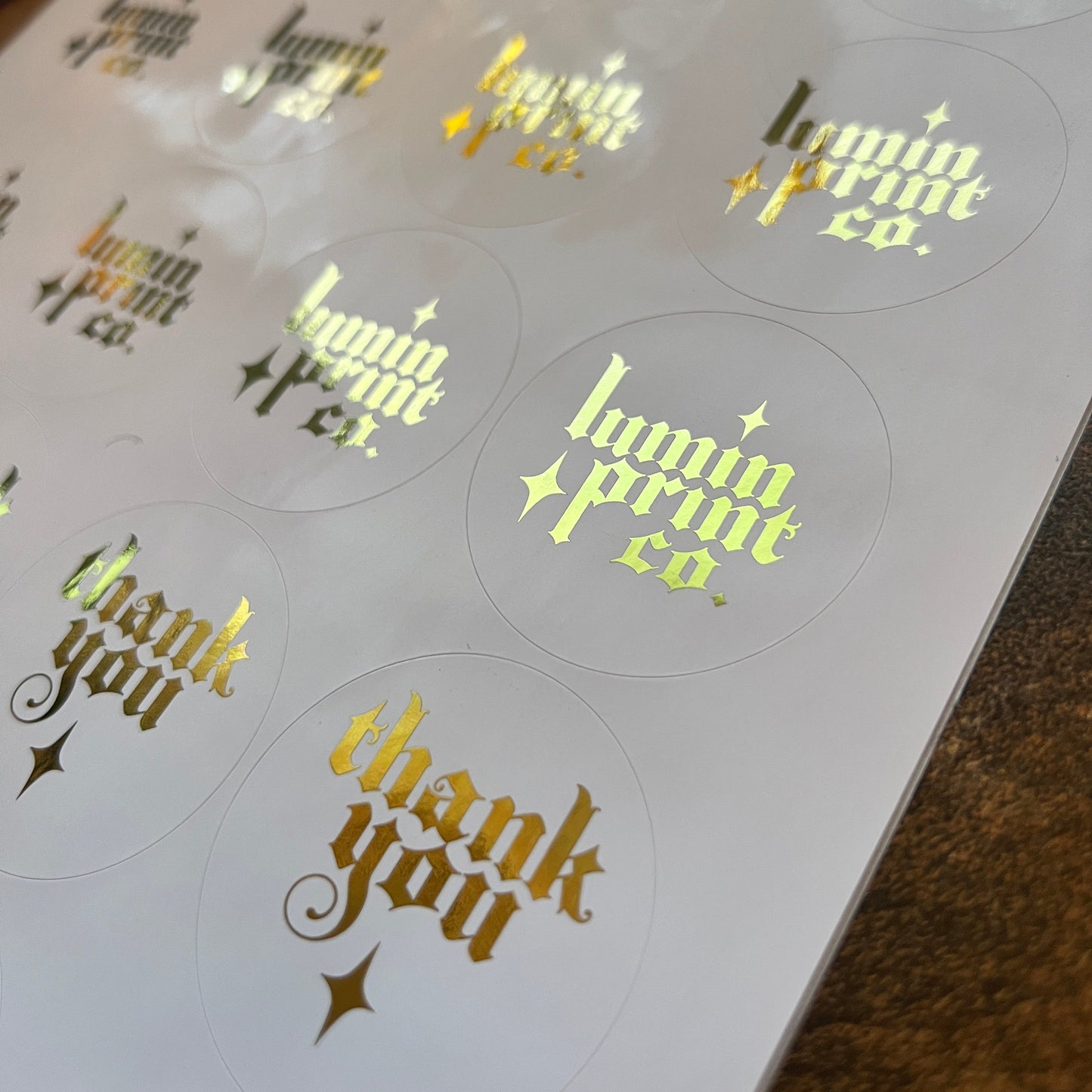 White Stickers with Foiled Text